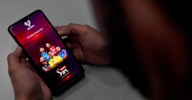 This photo shows a user checking the IPL Dream11 application, New Delhi, Oct. 12, 2020. (AFP Photo)