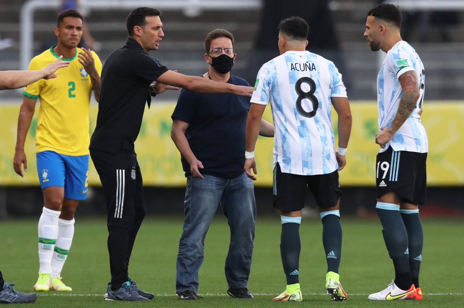 Argentina&#039;s Marcos Acuna (2nd R), and Nicolas Otamendi (R) argue with a Brazilian health official on the pitch, Sao Paulo, Brazil, Sept. 5, 2021. (Reuters Photo)