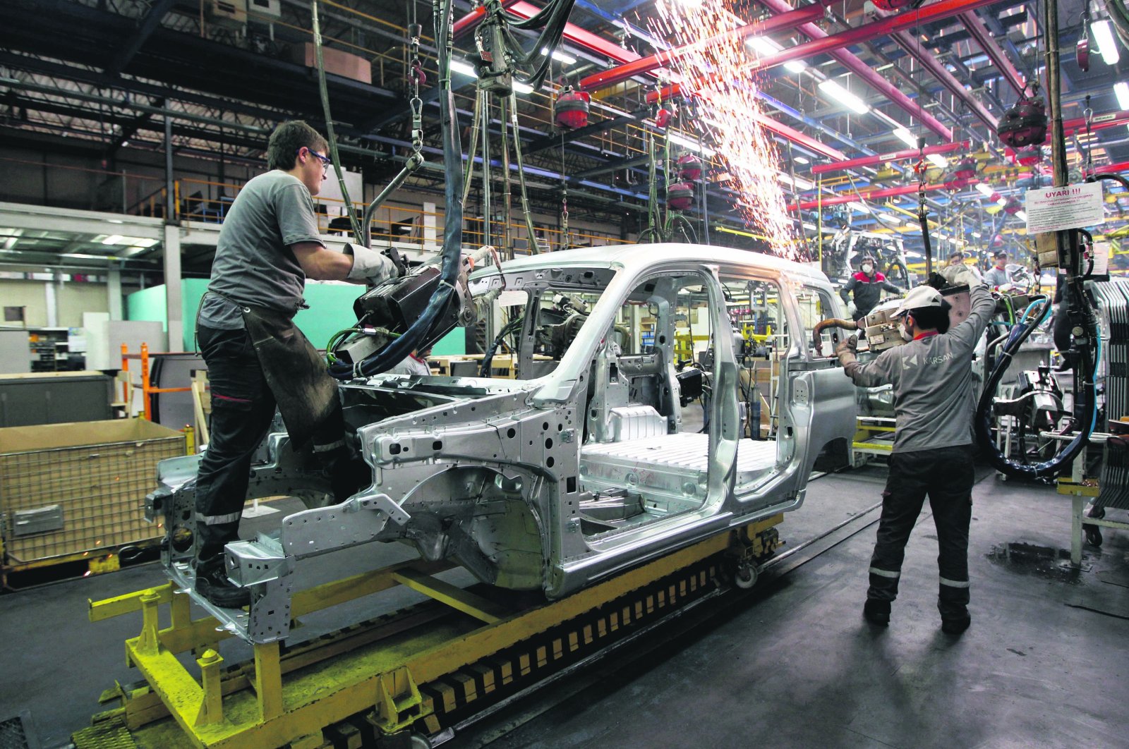 Employees work on the assembly line of the Karsan automotive factory in Bursa, Turkey, June 27, 2020. (Reuters Photo)