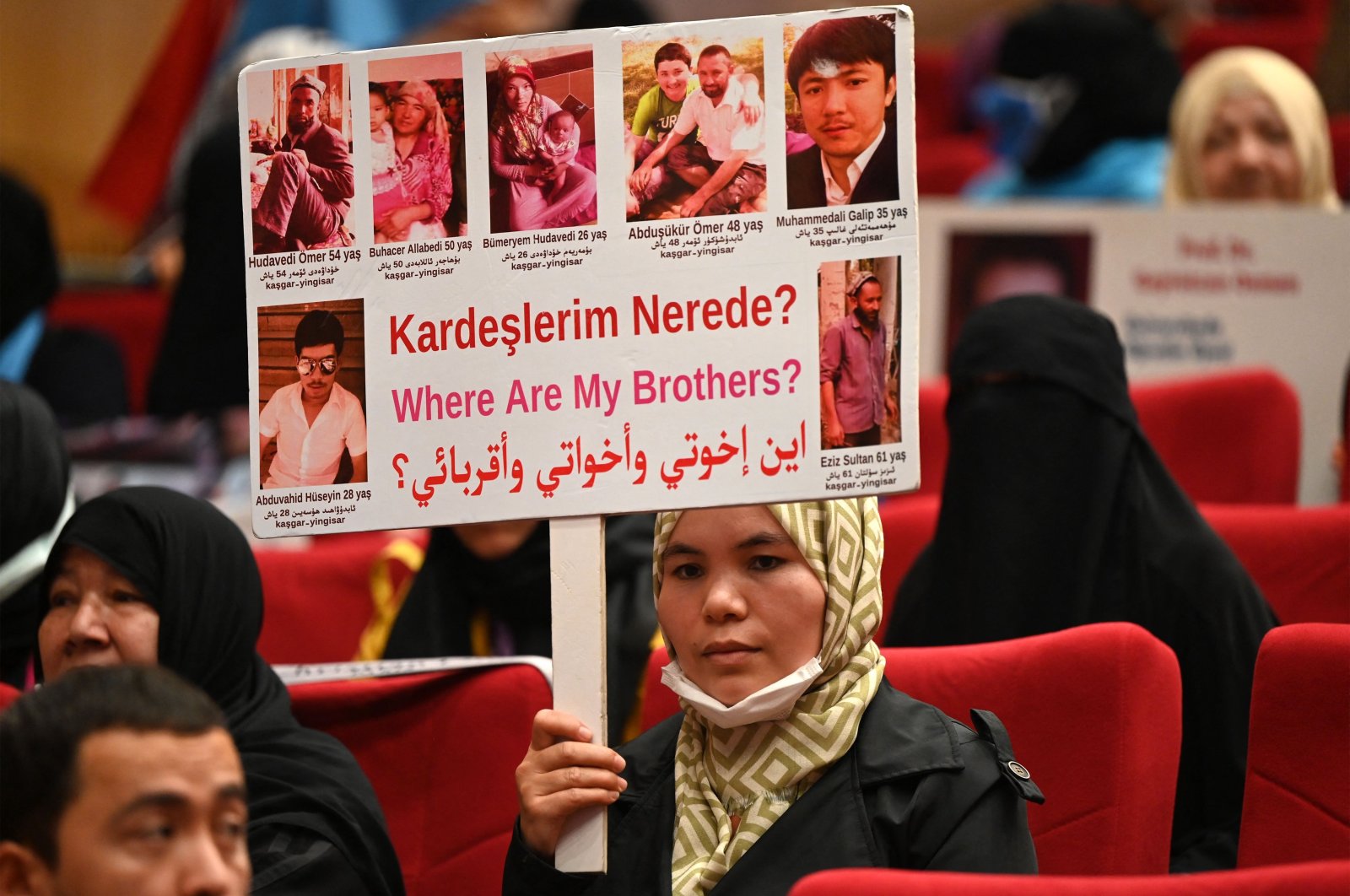 Members of the Muslim Uyghur minority present pictures of their relatives detained in China during a press conference in Istanbul, Turkey, May 10, 2022. (AFP Photo)