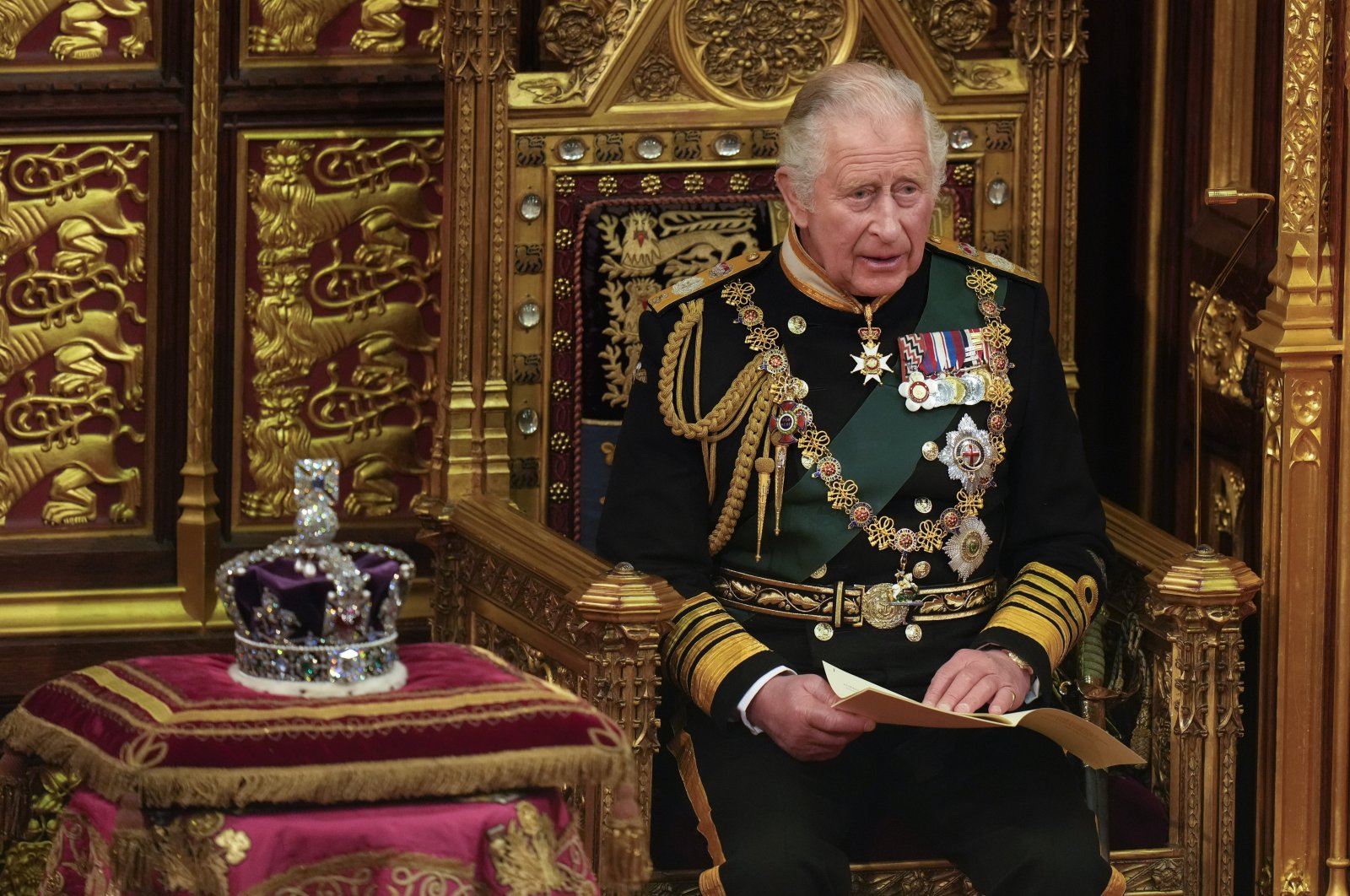 Prince Charles reads the queen&#039;s speech seated next to her crown during the State Opening of Parliament, at the Palace of Westminster in London, Britain, May 10, 2022. (AP Photo)