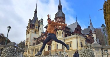 University student Erkan Orhan, 24, has visited 120 cities in 14 countries by hitchhiking, Sinaia, Romania, May 9, 2022. (DHA Photo)