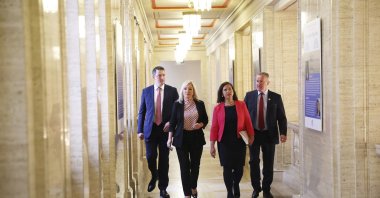 From left, Sinn Fein's Pat Finucane, Michelle O'Neil, party leader Mary Lou McDonald and Conor Murphy walk through the corridors of Parliament, Belfast, Northern Ireland, May 9, 2022. (AP Photo)