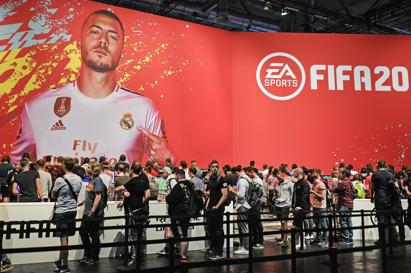 Fans check EA Sports FIFA 20 video game at the Gamescom, Cologne, Germany, Aug. 20, 2019. (AP Photo)