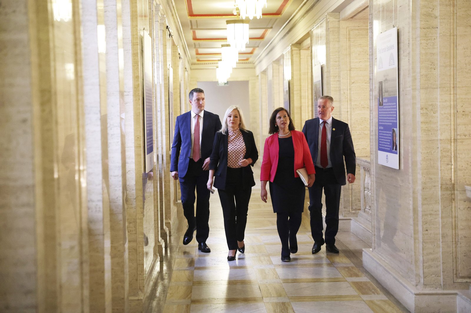 From left, Sinn Fein&#039;s Pat Finucane, Michelle O&#039;Neil, party leader Mary Lou McDonald and Conor Murphy walk through the corridors of Parliament, Belfast, Northern Ireland, May 9, 2022. (AP Photo)
