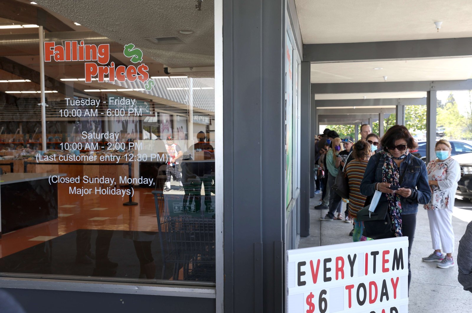 Customers wait in line to enter the Falling Prices! store in Santa Rosa, California, U.S., May 03, 2022. (EPA Photo)