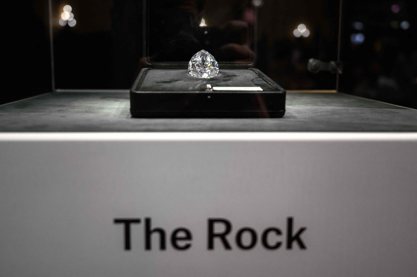 &quot;The Rock,&quot; the biggest white diamond ever to be sold at an auction is pictured prior to the start of Christie&#039;s Magnificent Jewels sales in Geneva, May 11, 2022. (AFP Photo)