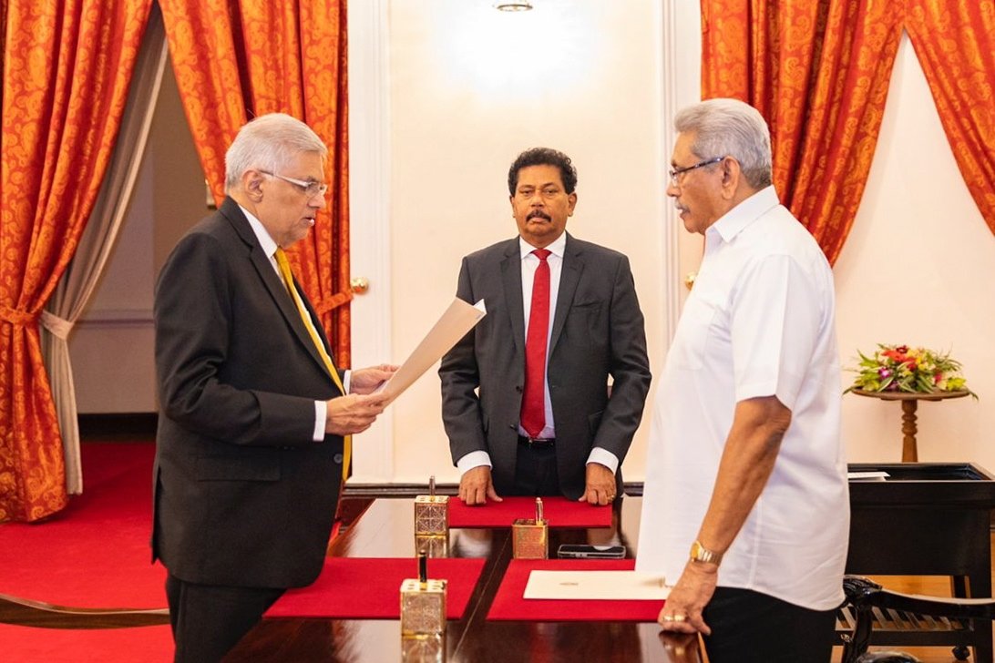 A handout photo made available by the Sri Lankan president&#039;s media division shows United National Party (UNP) leader Ranil Wickremesinghe (L) taking the oath of office as the 26th prime minister in Sri Lanka before President Gotabaya Rajapaksa (R) in Colombo, Sri Lanka, May 12, 2022. (EPA Photo)