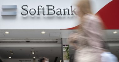 Pedestrians walk past a SoftBank mobile shop in Tokyo, Japan, May 12, 2022. (AFP Photo)