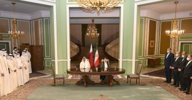 Qatar's Emir Sheikh Tamim bin Hamad Al Thani (C-L) meets with Iran's President Ebrahim Raisi, in the capital Tehran, May 12, 2022. (Photo by Qatar Amiri Diwan via AFP)