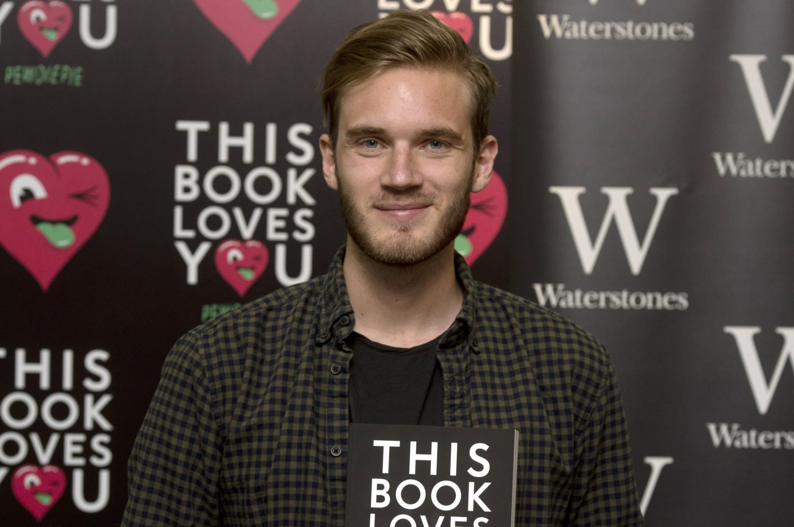 Felix Kjellberg, also known as PewDiePie, the most-subscribed YouTuber in the world during a photo call to launch his book &quot;This Book Loves You,&quot; at Waterstones Piccadilly, London, U.K., Oct. 18, 2015. (PA Images via Reuters)