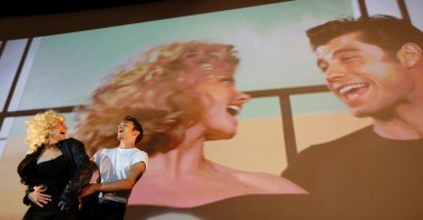 Dancers perform during the final scene of the Future Cinema outdoor screening of the 1978 film "Grease" in Barnes, southwest London, Britain, Sept. 9, 2012. (REUTERS Photo)
