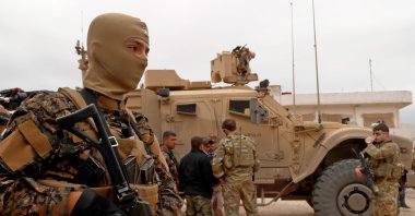 U.S. forces along with YPG terrorists patrol the town of Al-Darbasiyah bordering Turkey, northeastern Syria, Nov. 4, 2018. (AFP)