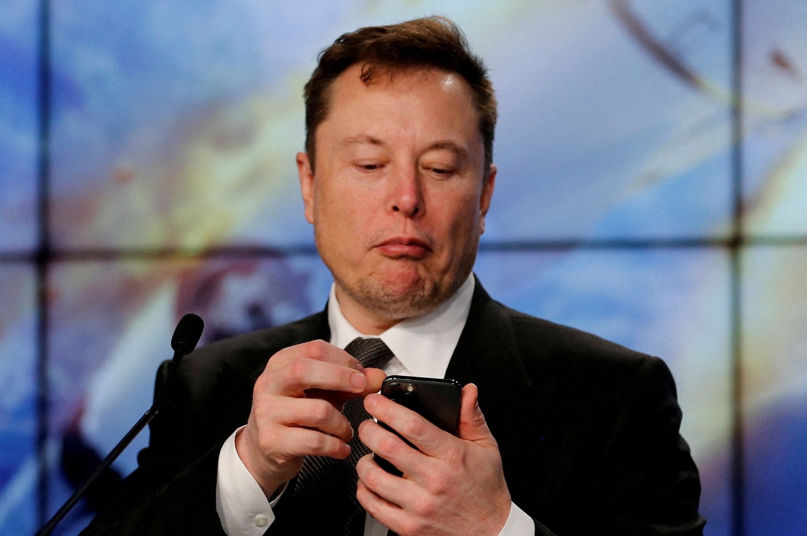 Elon Musk looks at his mobile phone in Cape Canaveral, Florida, U.S. Jan. 19, 2020. (Reuters Photo)