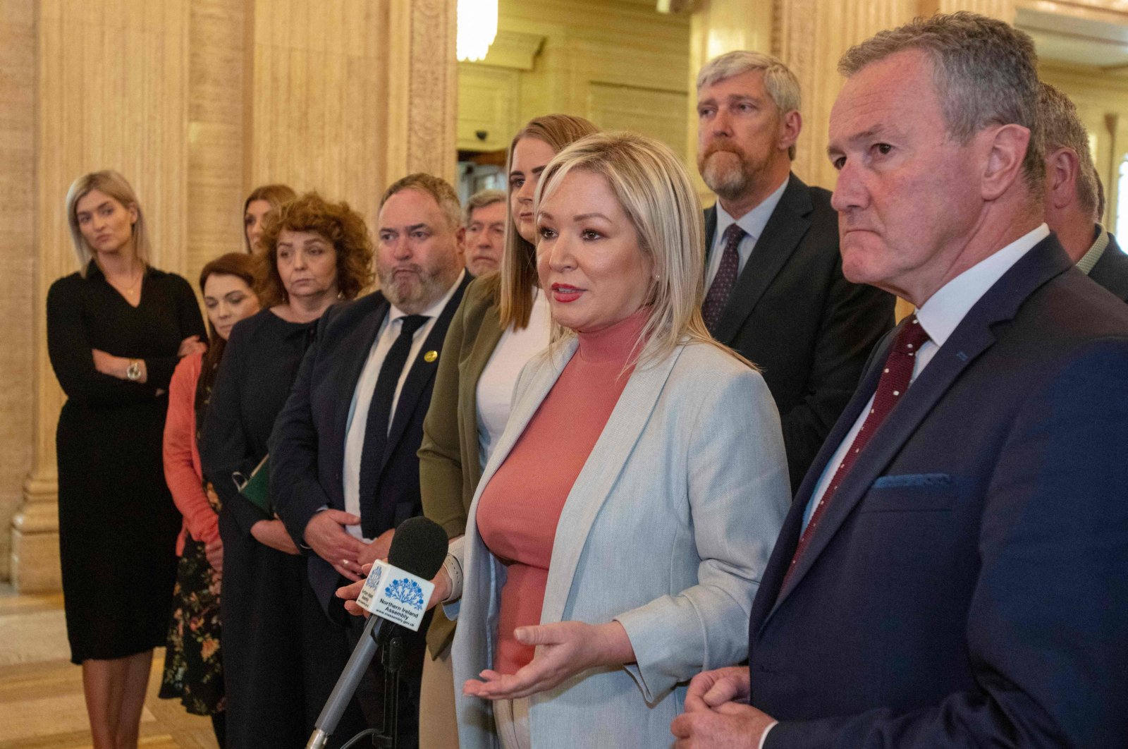 Northern Ireland&#039;s Deputy First Minister and Sinn Fein party leader Michelle O&#039;Neill (C) and her Assembly team emerge from the chamber after the Democratic Unionist Party (DUP) failed to nominate a speaker, stopping the election of a first and deputy first minister, Stormont Estate, Belfast, Northern Ireland, on May 13, 2022. (AFP Photo)