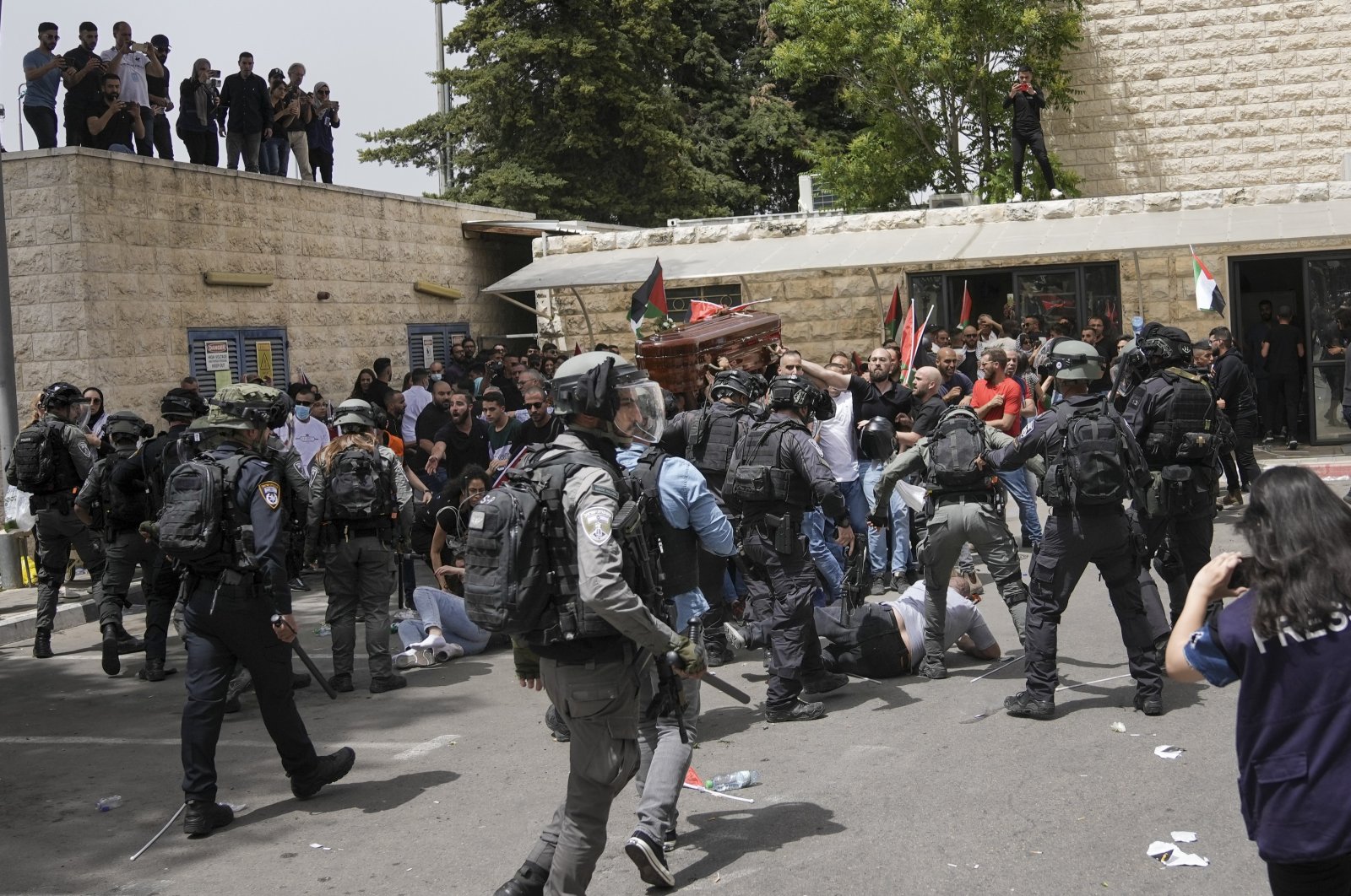Israeli police attack mourners as they carry the coffin of slain Al Jazeera veteran journalist Shireen Abu Akleh during her funeral in East Jerusalem, Palestine, May 13, 2022. (AP Photo)