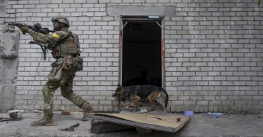 A Ukrainian officer patrols during a reconnaissance mission in a recently retaken village on the outskirts of Kharkiv, east Ukraine, May 14, 2022. (AP Photo)