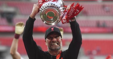 Liverpool manager Juergen Klopp celebrates with the FA Cup trophy, London, England, May 14, 2022. (EPA Photo)