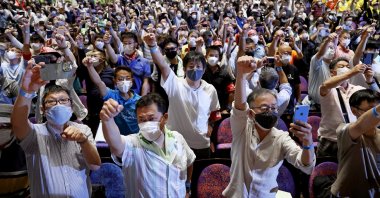 Protesters stage a rally, demanding a speedier reduction of U.S. military forces in Naha, Okinawa, May 15, 2022. (AP Photo)