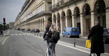 Tourists ride scooters on Rivoli street in Paris, France, May 2, 2022. (AP Photo)