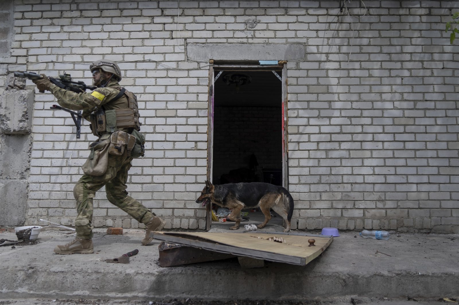 A Ukrainian officer patrols during a reconnaissance mission in a recently retaken village on the outskirts of Kharkiv, east Ukraine, May 14, 2022. (AP Photo)