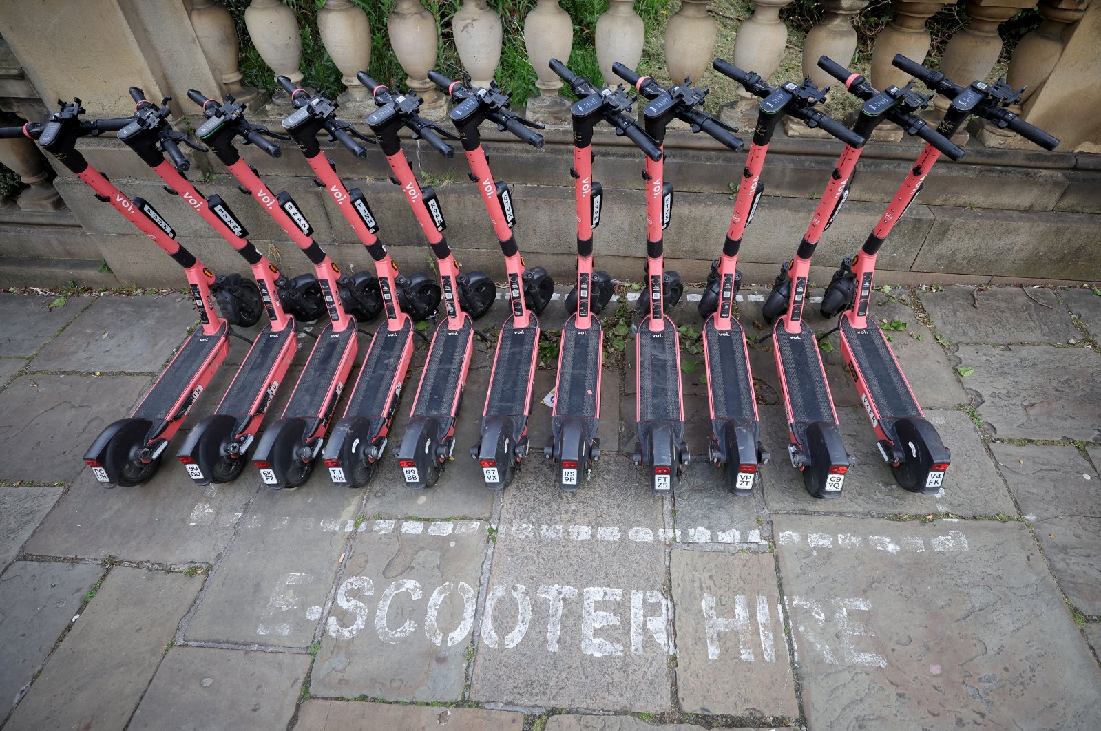 A row of Voi e-scooters is pictured in Liverpool, Britain, May 13, 2022. (Reuters Photo)