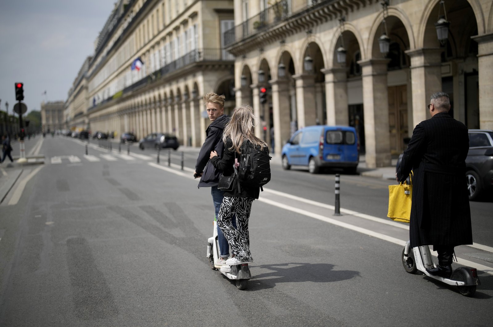 Tourists ride scooters on Rivoli street in Paris, France, May 2, 2022. (AP Photo)