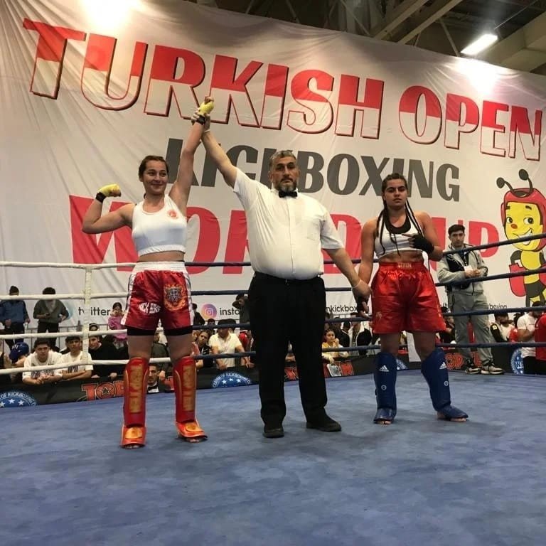 Cemile Aykoç (L) declared the winner in the Kick Boxing World Cup K-1 final, Istanbul, Turkey, May 16, 2022. (IHA Photo)
