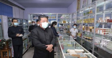 North Korean leader Kim Jong Un (C) visits a pharmacy in Pyongyang, North Korea, Sunday, May 15, 2022. (AP Photo)