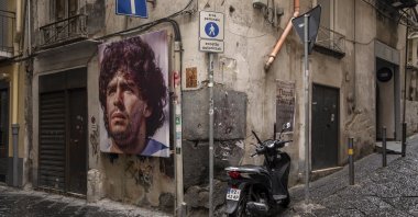 A mural showing Argentinian footballer Diego Maradona, who has become one of the Naples&#039; many patron saints since his death in 2020, on a street in Naples, Italy, Nov. 23, 2021. (dpa Photo)