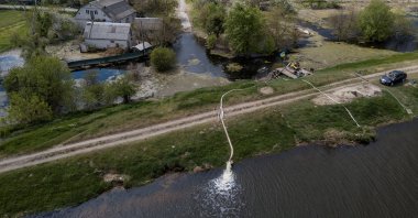 A water pump station is seen in a flooded area after Ukrainian military forces opened a dam to flood a residential area to stop Russian forces from advancing to the capital, Demydiv, Ukraine, May, 15, 2022. (Reuters Photo)