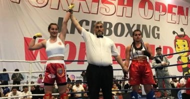 Cemile Aykoç (L) declared the winner in the Kick Boxing World Cup K-1 final, Istanbul, Turkey, May 16, 2022. (IHA Photo)