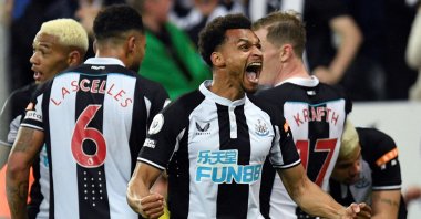 Newcastle United's Jacob Murphy celebrates after Newcastle United's Brazilian midfielder Bruno Guimaraes (R) scored the team's second goal in a English Premier League match vs. Arsenal, Newcastle, England, May 16, 2022. (AFP Photo)