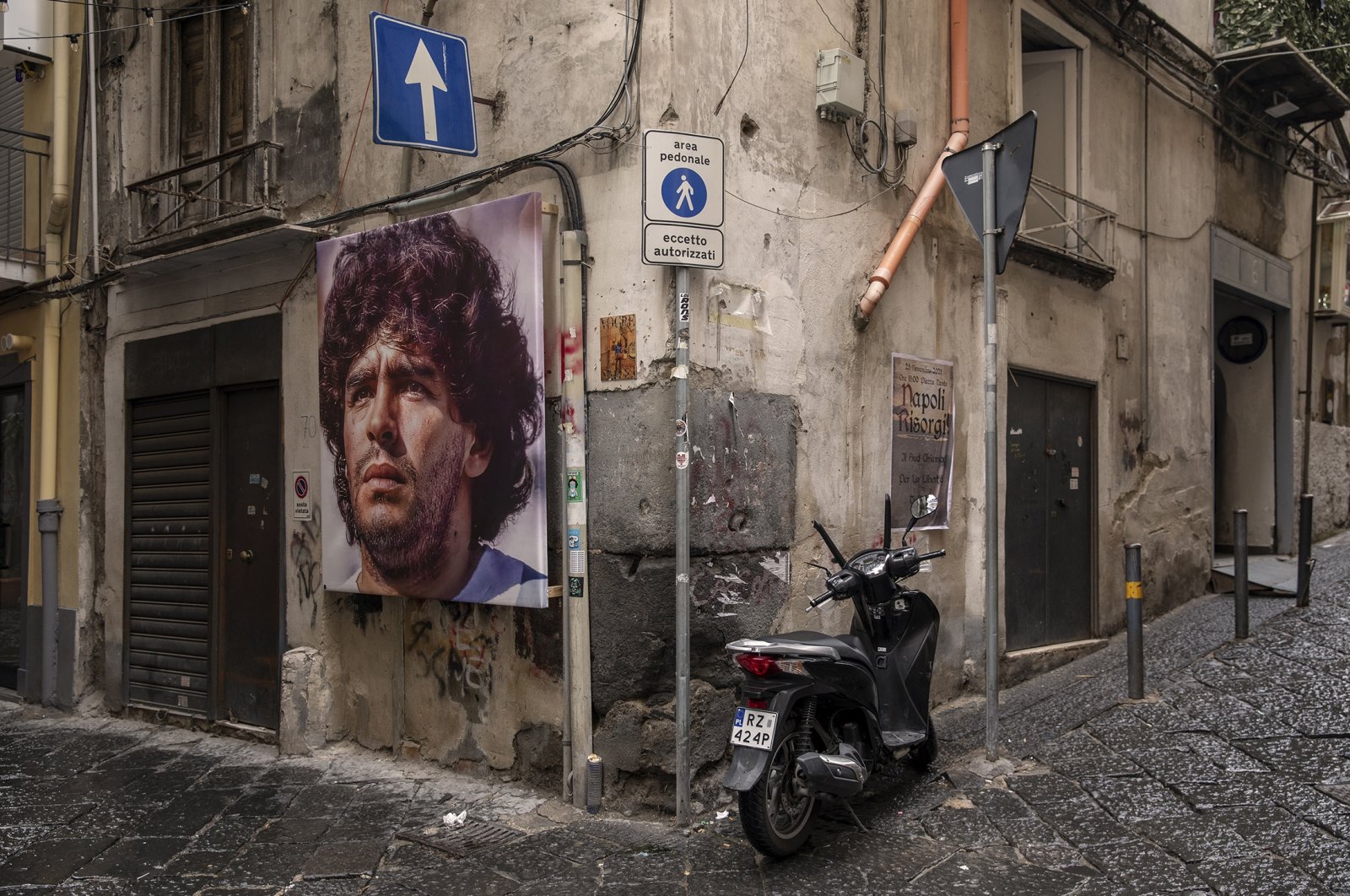A mural showing Argentinian footballer Diego Maradona, who has become one of the Naples&#039; many patron saints since his death in 2020, on a street in Naples, Italy, Nov. 23, 2021. (dpa Photo)