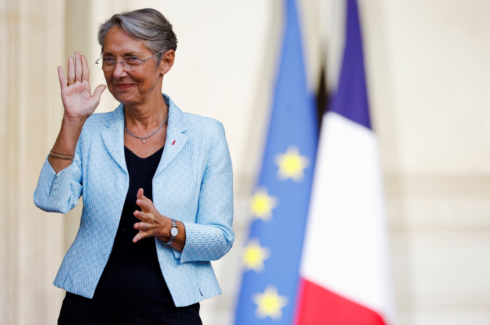 Newly appointed French Prime Minister Elisabeth Borne gestures as she attends a handover ceremony in the courtyard of Hotel Matignon in Paris, France, May 16, 2022. (Reuters Photo)