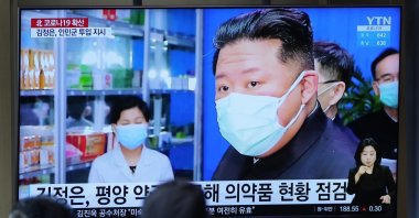 People watch a TV screen showing a news program reporting with an image of North Korean leader Kim Jong Un, at a train station in Seoul, South Korea, May 16, 2022. (AP Photo)