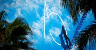 A view shows a giant canvas of the official poster featuring actor Jim Carrey in the film &quot;The Truman Show,&quot; on the facade of the Festival Palace on the eve of the opening ceremony. (REUTERS Photo)