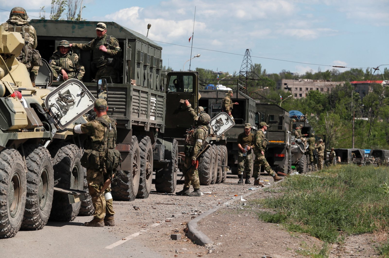 A convoy of pro-Russian troops is seen before the expected evacuation of wounded Ukrainian soldiers from the besieged Azovstal steel mill in the course of Ukraine-Russia conflict in Mariupol, Ukraine, May 16, 2022. (Reuters Photo)
