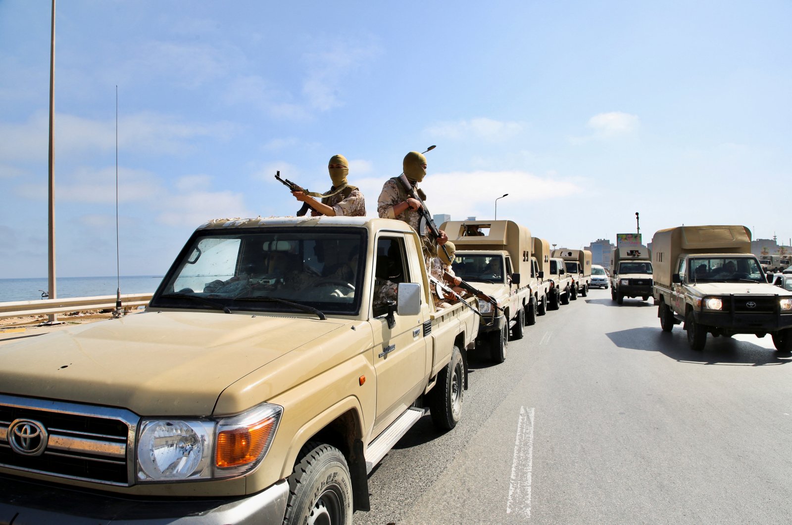 Soldiers loyal to the head of Libya&#039;s Government of National Unity sit in trucks in Tripoli, Libya, May 17, 2022. (REUTERS Photo)