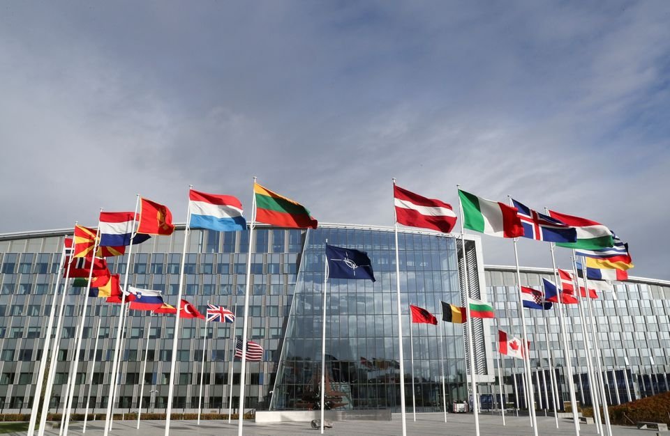 Flags wave outside the Alliance headquarters ahead of a NATO Defense Ministers meeting, Brussels, Belgium, Oct. 21, 2021. (Reuters Photo)
