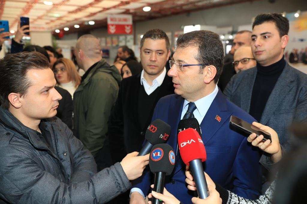 Murat Ongun (L) stands next to Mayor İmamoğlu as he speaks to reporters at an event, in Istanbul, Turkey, Feb. 10, 2020. (AA PHOTO) 