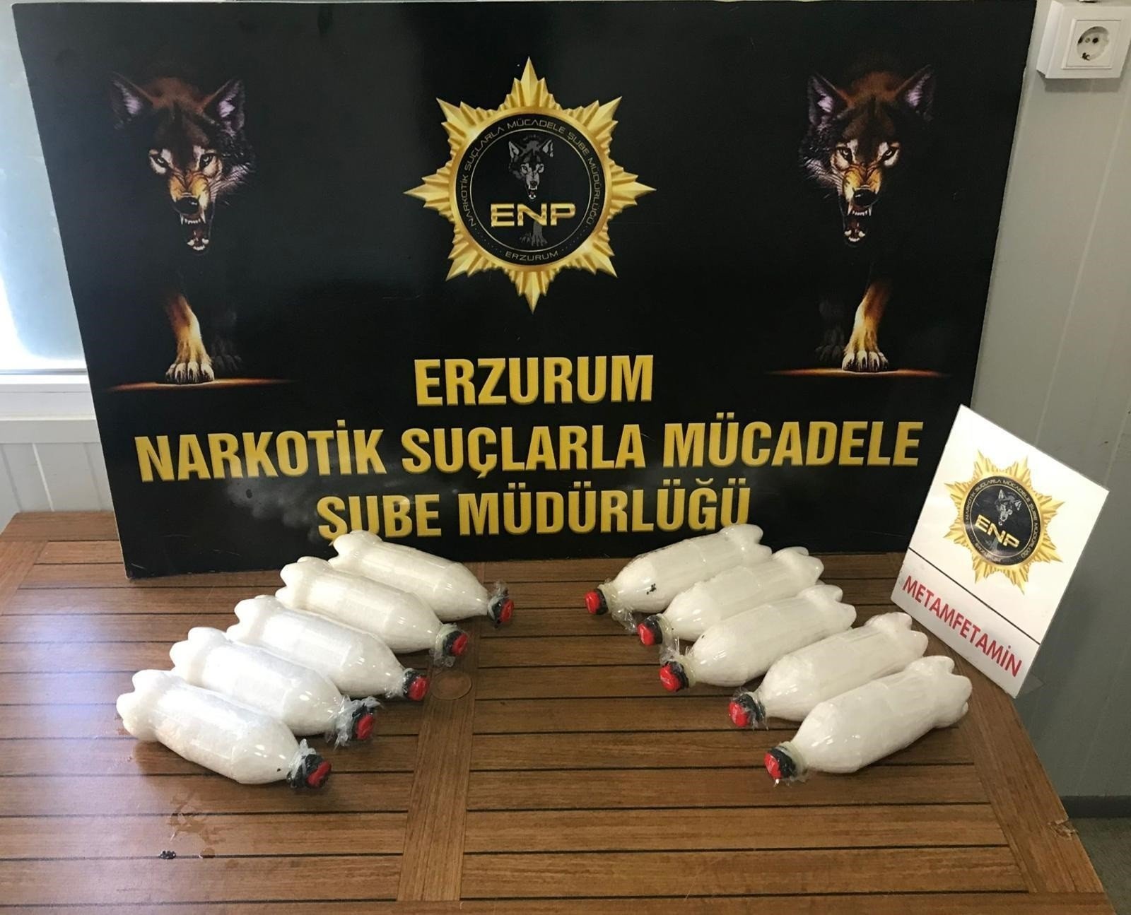 Methamphetamine stashed in bottles on a police display, in Erzurum, eastern Turkey, May 17, 2022. (İHA PHOTO) 