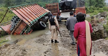 People inspect the area of a landslide after heavy rainfall in Dima Hasao district, in the northeastern Indian state of Assam, May 16, 2022. (AP Photo)