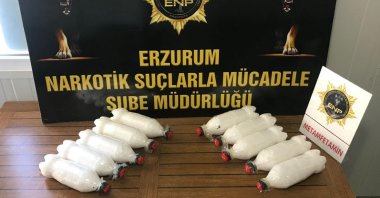 Methamphetamine stashed in bottles on a police display, in Erzurum, eastern Turkey, May 17, 2022. (İHA PHOTO) 
