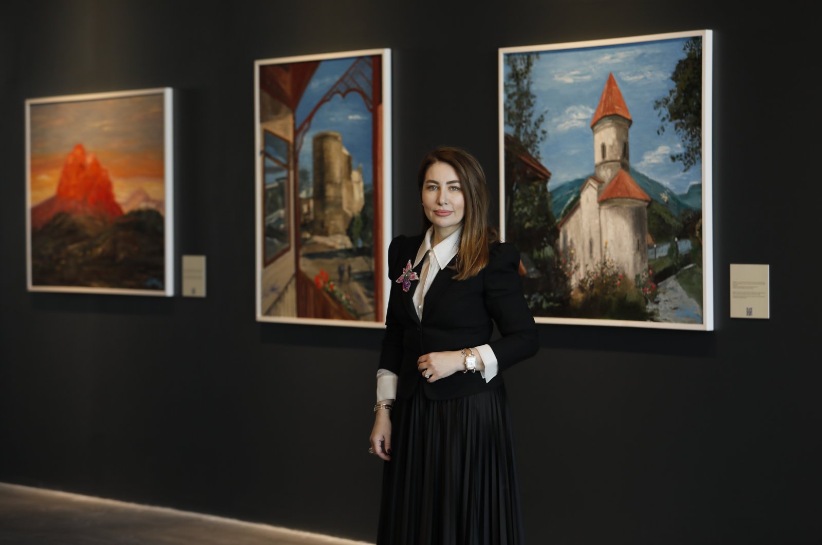 Nigar Helmi Abbasbayli poses with her works at the Atatürk Cultural Center, Istanbul. 