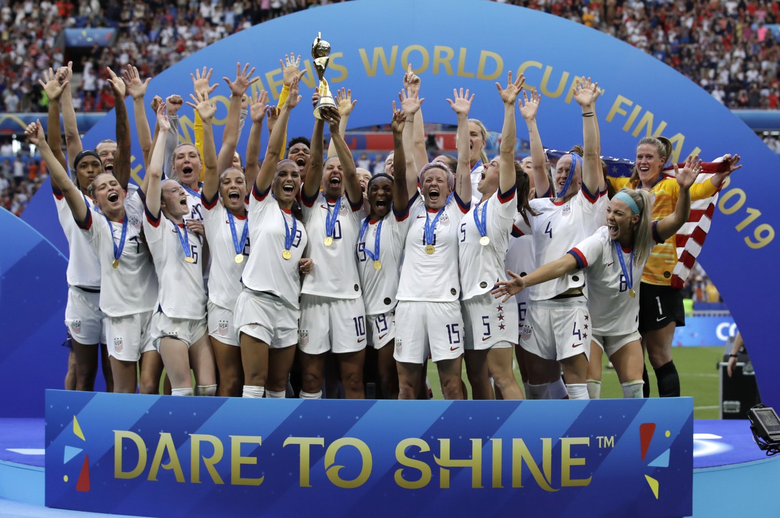 Team U.S. celebrates with the Women&#039;s World Cup trophy after winning the final against the Netherlands, Lyon, France, July 7, 2019. (AP Photo)