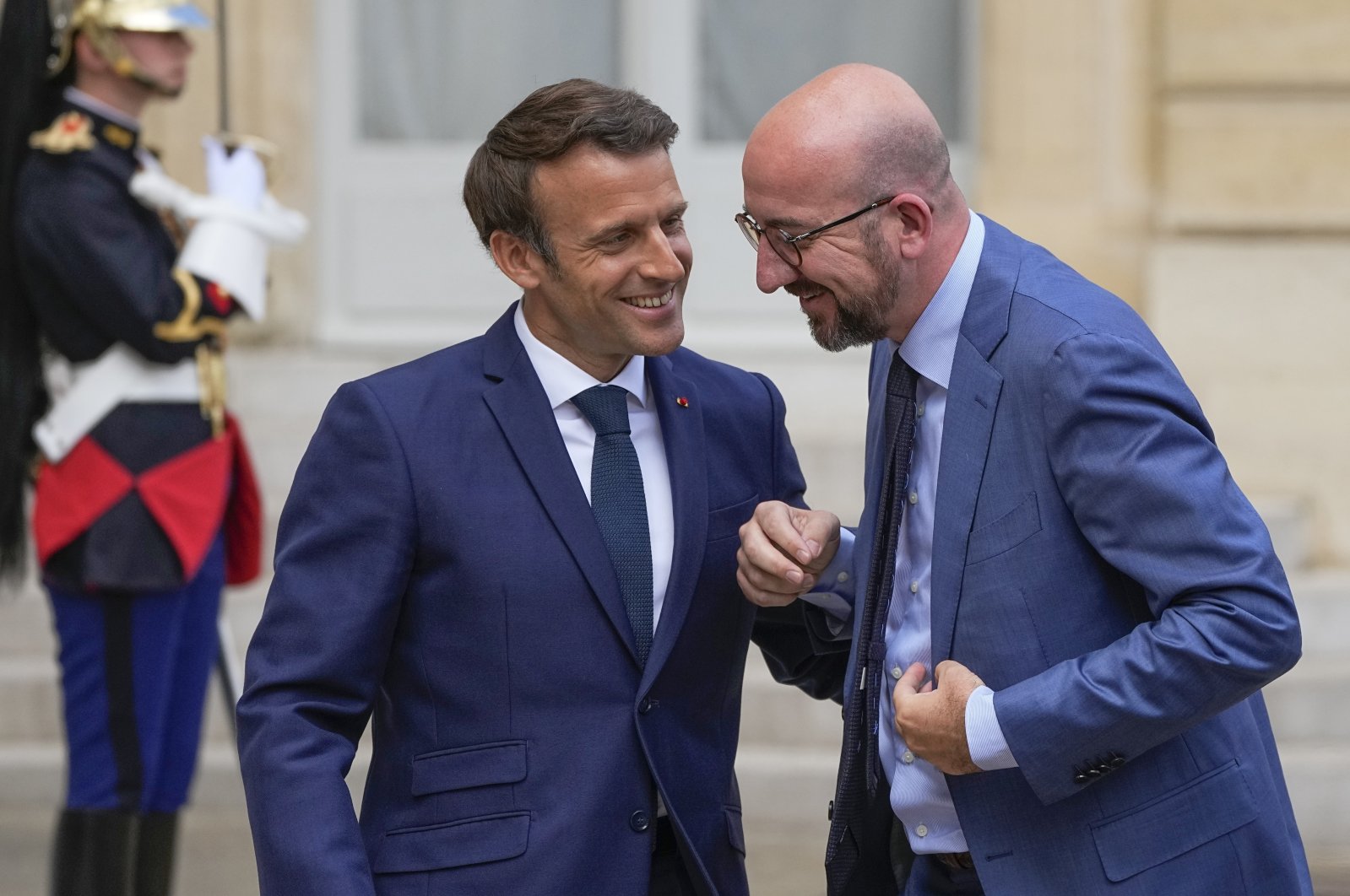 French President Emmanuel Macron (L) greets European Council President Charles Michel for lunch at the Elysee Palace, Paris, France, May 16, 2022. (AP Photo)
