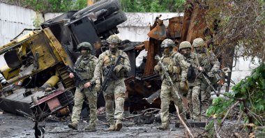 Russian officers patrol the destroyed part of the Ilyich iron and steelworks in the port city of Mariupol, Ukraine, May 18, 2022, Ukraine. (AFP Photo)