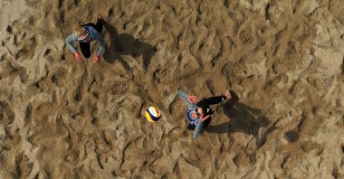 Two beach volleyball players in action at the VW Beach Pro Tour Kuşadası Challenge, Aydın, Turkey, May 19, 2022. (AA Photo)