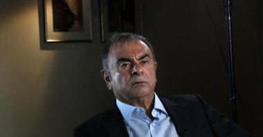 Former Nissan executive Carlos Ghosn speaks during an interview with The Associated Press, in Dbayeh, north of Beirut, Lebanon, May 25, 2021. Lebanon received from Interpol a wanted notice for disgraced auto tycoon Carlos Ghosn on May 19, 2022, four weeks after French prosecutors issued an international arrest warrant for him, Lebanese judicial officials said. (AP File Photo)